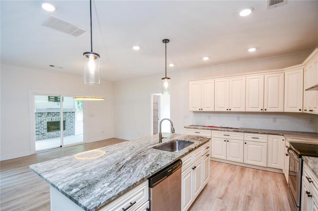 5354 Shadow Walk Way, Gainesville, GA 30507 - kitchen featuring stainless steel appliances, a sink, light wood-style flooring, white cabinets, and pendant lighting