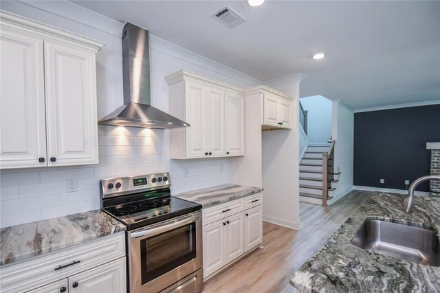 5354 Shadow Walk Way, Gainesville, GA 30507 - kitchen featuring wall chimney exhaust hood, stainless steel electric range oven, a sink, white cabinetry, and crown molding