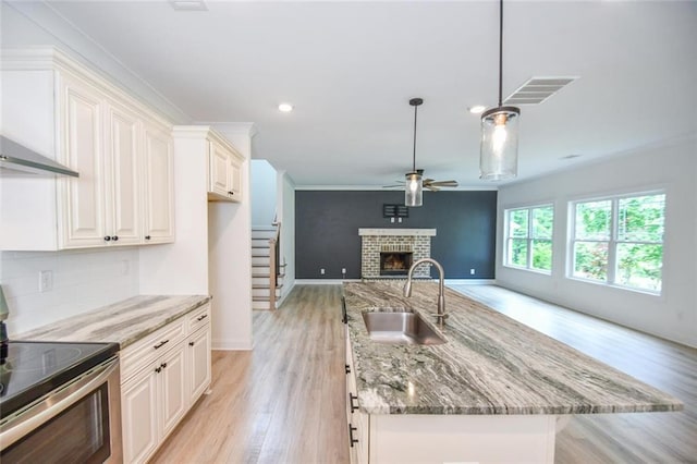5354 Shadow Walk Way, Gainesville, GA 30507 - kitchen featuring electric stove, a sink, wall chimney exhaust hood, a ceiling fan, and open floor plan