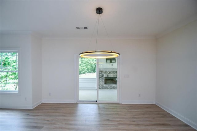 5354 Shadow Walk Way, Gainesville, GA 30507 - unfurnished dining area featuring wood finished floors, crown molding, and baseboards