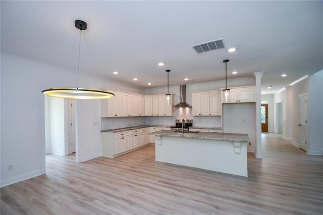 5354 Shadow Walk Way, Gainesville, GA 30507 - kitchen featuring wall chimney exhaust hood, a sink, baseboards, light wood finished floors, and hanging light fixtures