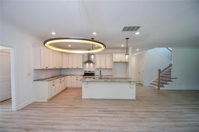 5354 Shadow Walk Way, Gainesville, GA 30507 - kitchen with a sink, wall chimney range hood, stainless steel range with electric stovetop, light wood finished floors, and recessed lighting