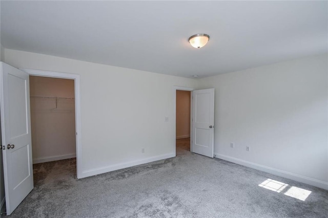 5354 Shadow Walk Way, Gainesville, GA 30507 - unfurnished bedroom featuring carpet, a spacious closet, baseboards, and a closet