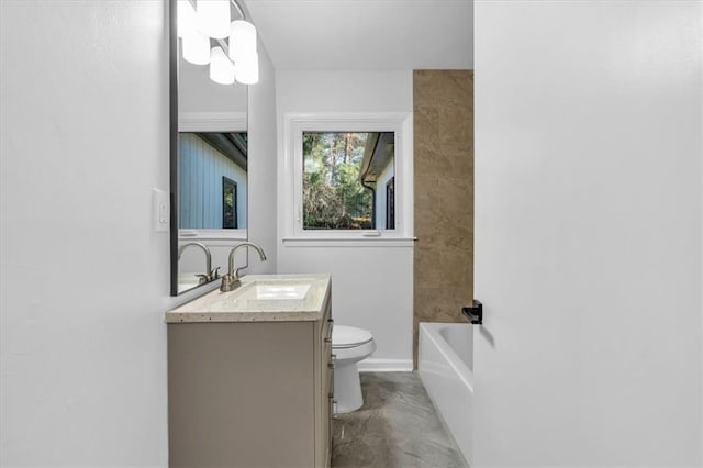 bathroom featuring vanity and toilet