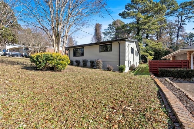 view of home's exterior with a lawn