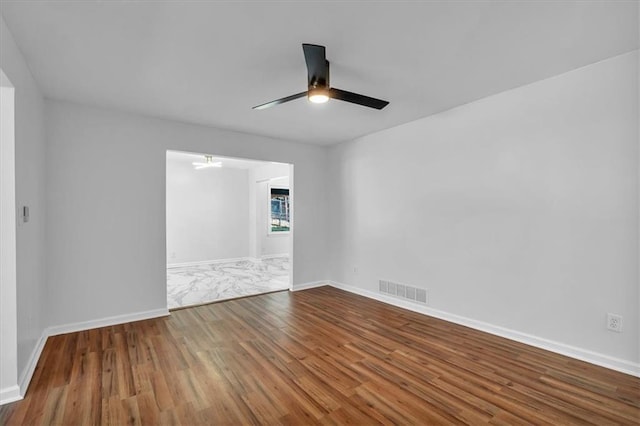 unfurnished room featuring hardwood / wood-style floors and ceiling fan