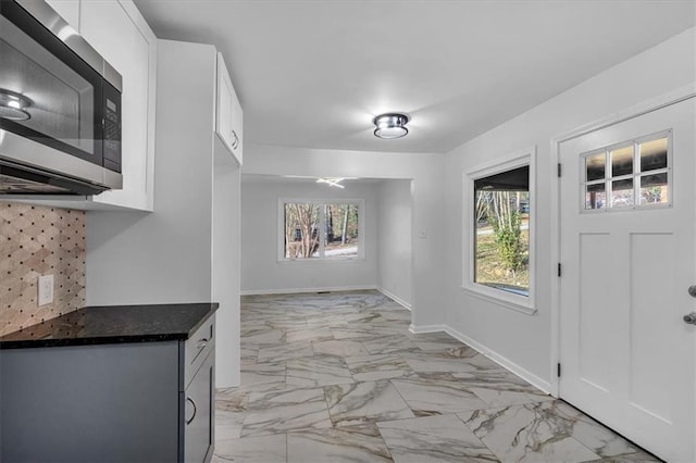 entrance foyer featuring plenty of natural light