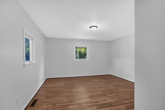 empty room featuring hardwood / wood-style flooring