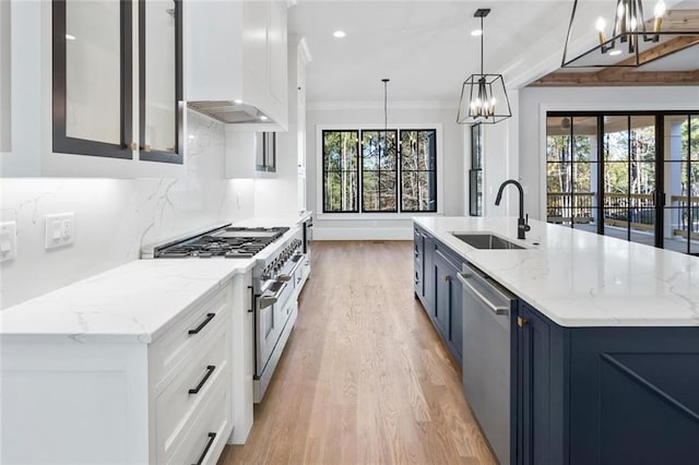 kitchen with stainless steel appliances, a large island, sink, and hanging light fixtures