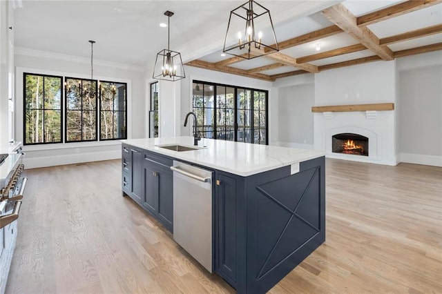 kitchen with sink, dishwasher, light hardwood / wood-style floors, an island with sink, and decorative light fixtures