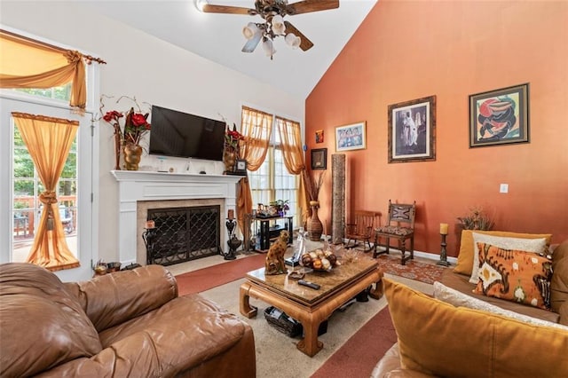 carpeted living room featuring high vaulted ceiling, plenty of natural light, and ceiling fan