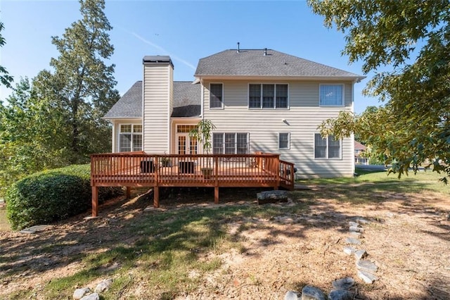 back of property with a wooden deck