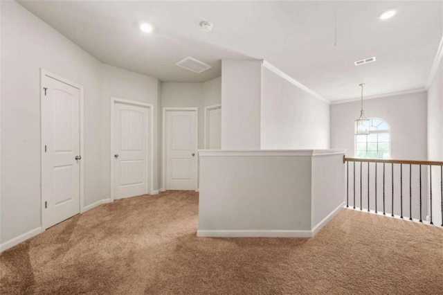 empty room with visible vents, ornamental molding, carpet flooring, and recessed lighting