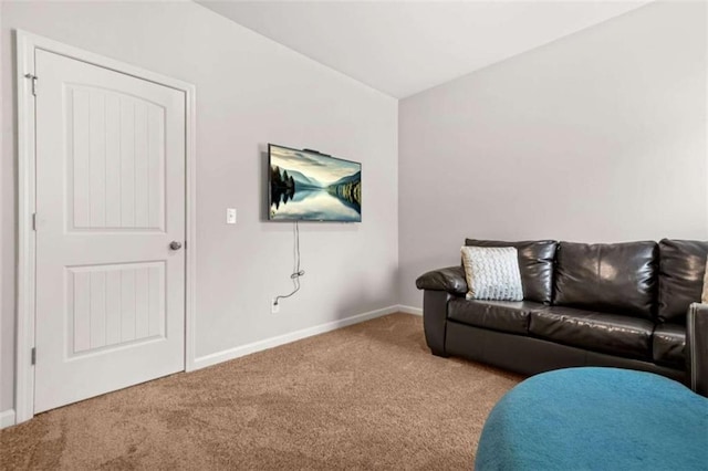 living room with carpet and baseboards