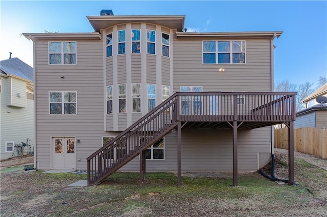 back of property with a wooden deck