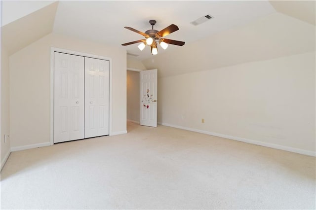 bonus room featuring ceiling fan, light colored carpet, and lofted ceiling