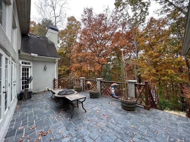 view of patio / terrace with a fire pit