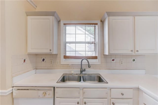 kitchen featuring a sink, white cabinetry, light countertops, decorative backsplash, and dishwasher