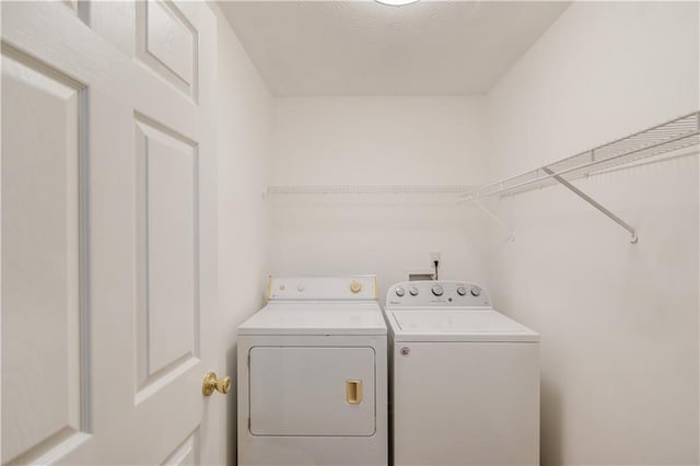 laundry area featuring laundry area and independent washer and dryer