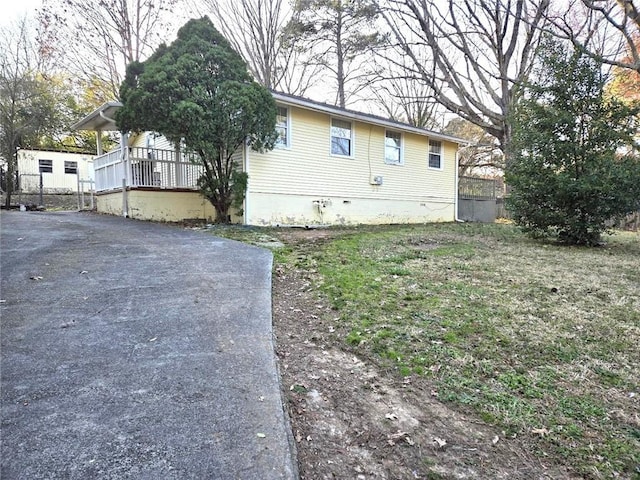 3254 Howell Cir, Duluth, GA 30096 - view of home's exterior featuring crawl space and asphalt driveway