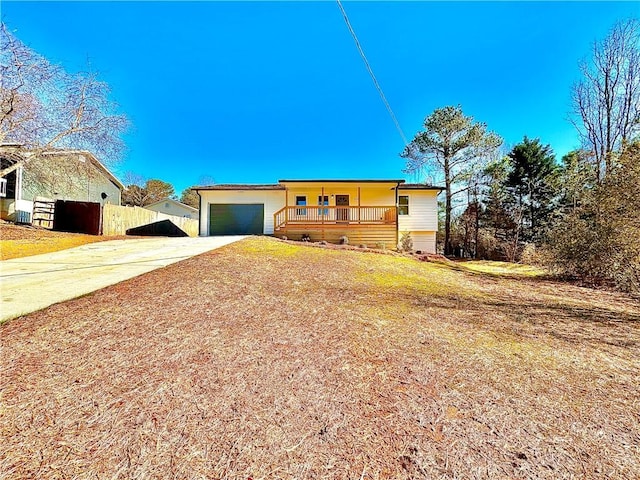 split foyer home with covered porch and a garage