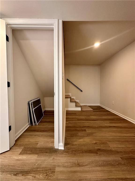 stairway featuring hardwood / wood-style flooring