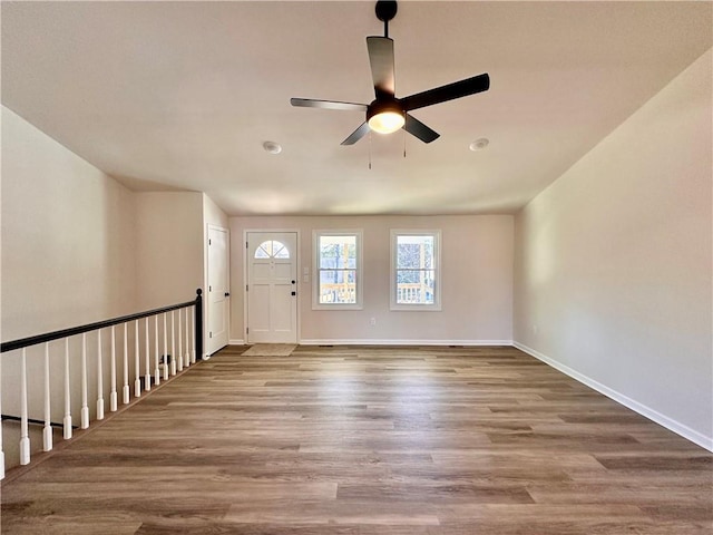 foyer entrance featuring hardwood / wood-style floors and ceiling fan