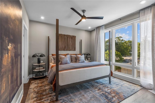 bedroom featuring wood-type flooring and ceiling fan