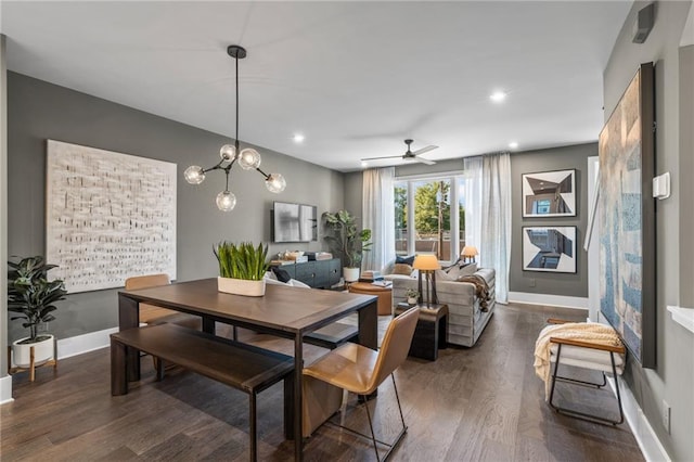 dining room with ceiling fan and dark hardwood / wood-style flooring