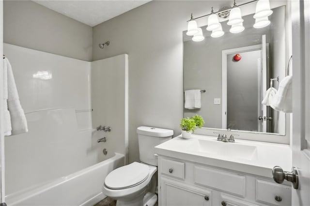 full bathroom with washtub / shower combination, vanity, and toilet