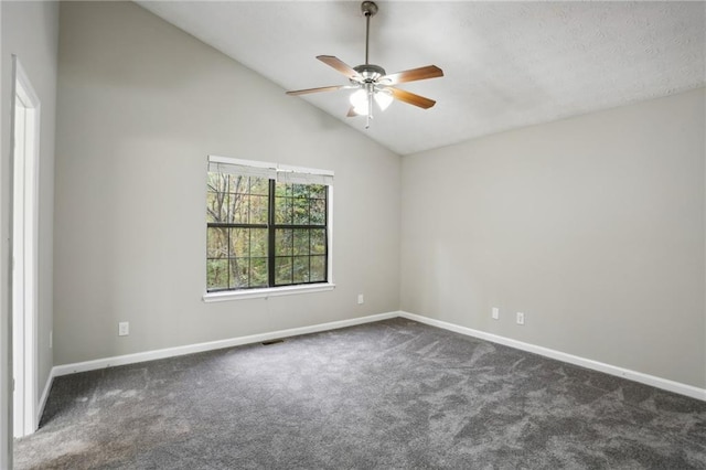 carpeted empty room with ceiling fan and lofted ceiling