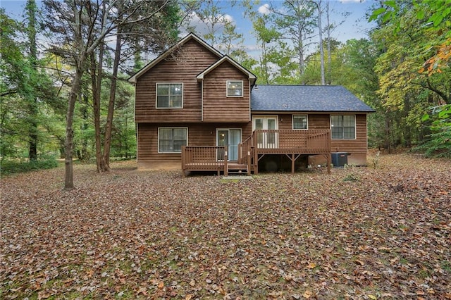 back of house with a deck and cooling unit