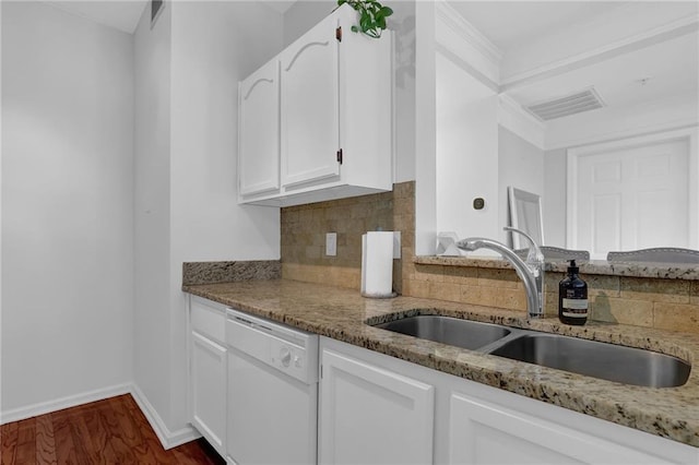 kitchen with sink, dishwasher, tasteful backsplash, light stone countertops, and white cabinets