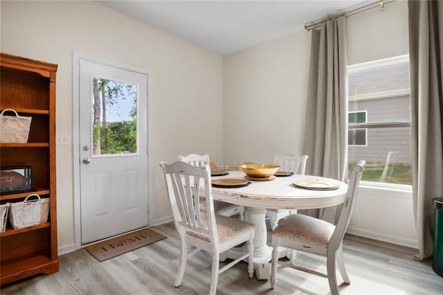 217 Limestone Cir, Conyers, GA 30013 - dining room with light wood finished floors