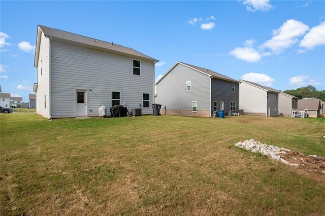 217 Limestone Cir, Conyers, GA 30013 - rear view of house with a lawn and central air condition unit