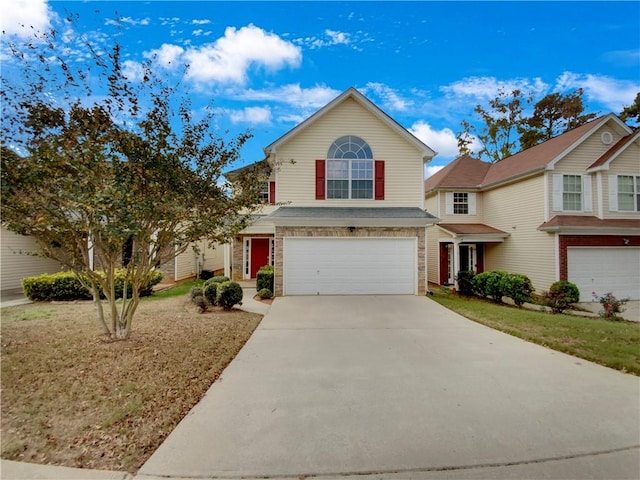 front of property featuring a garage and a front yard