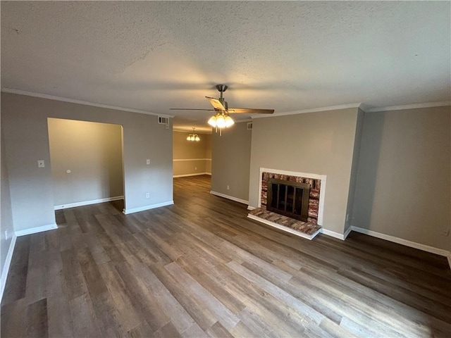 2992 Parc Lorraine, Lithonia, GA 30038 - unfurnished living room featuring ceiling fan, a brick fireplace, crown molding, dark wood-type flooring, and a textured ceiling