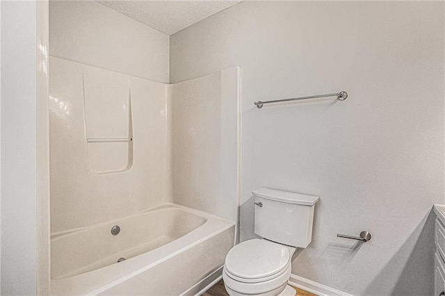 full bathroom with toilet, baseboards, a textured ceiling, shower / tub combination, and wood finished floors