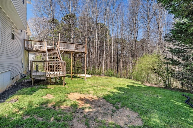view of yard featuring stairs and a deck
