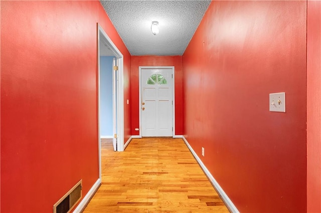 300 S Dale Ave, Calhoun, GA 30701 - doorway featuring light wood finished floors and a textured ceiling