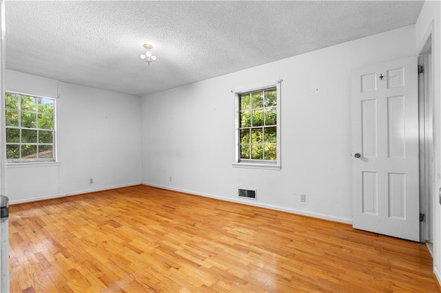 300 S Dale Ave, Calhoun, GA 30701 - empty room with a textured ceiling and light wood-style floors