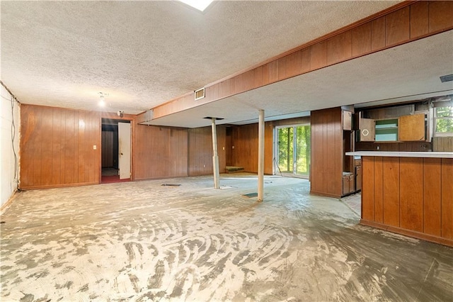 300 S Dale Ave, Calhoun, GA 30701 - basement with a textured ceiling and wood walls