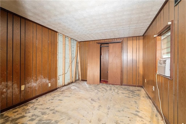 300 S Dale Ave, Calhoun, GA 30701 - empty room with wooden walls, a textured ceiling, and cooling unit
