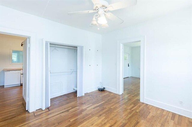 unfurnished bedroom featuring a closet, ceiling fan, and hardwood / wood-style floors