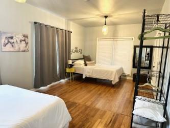 bedroom with dark wood-type flooring