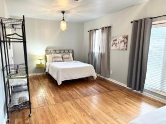 bedroom with hardwood / wood-style floors