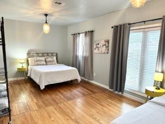 bedroom with hardwood / wood-style flooring