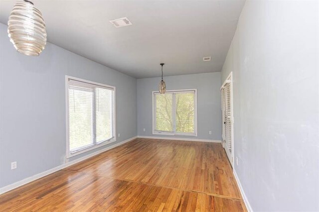 interior space with hardwood / wood-style floors and a notable chandelier