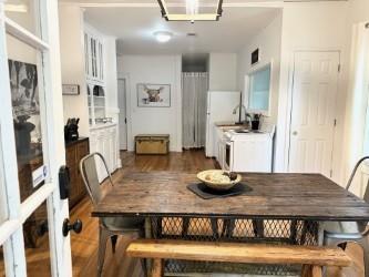 dining space featuring dark wood-type flooring