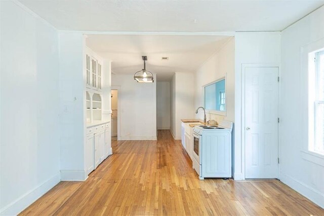 hall featuring sink and light hardwood / wood-style floors